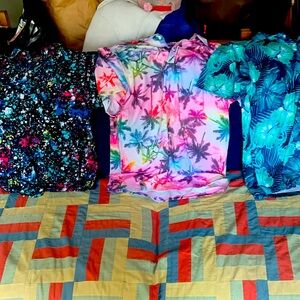 Three colourful golf shirts